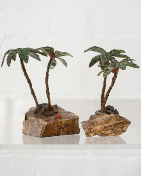 This unusual pair of semi-precious palm trees consist of Tiger's Eye trunks and Malachite leaves. These trees can be used as bookends or can remain as decorative items. Sold as a pair.