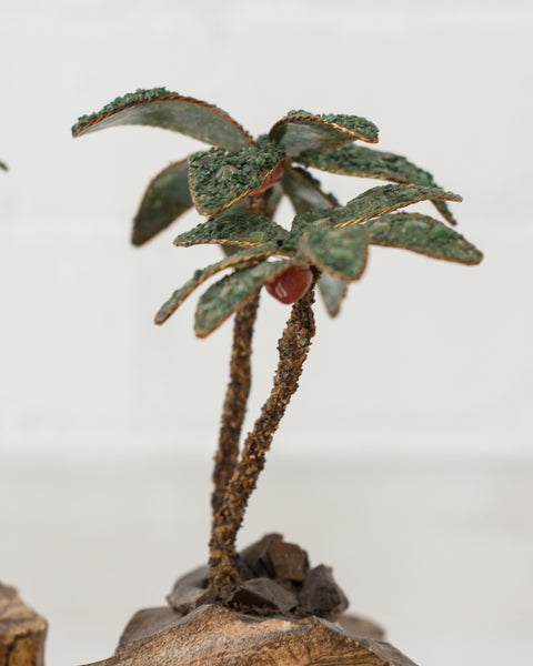 This unusual pair of semi-precious palm trees consist of Tiger's Eye trunks and Malachite leaves. These trees can be used as bookends or can remain as decorative items. Sold as a pair.