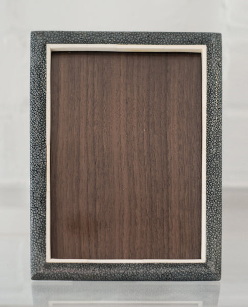 A small picture frame in blue/black Shagreen, bone & walnut, backed in suede.