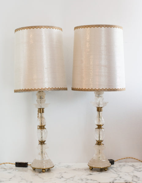 This pair of Rock Crystal and bronze lamps was sourced by Nurit in Paris. The stunning shades are hand crafted from metallic silk with vintage gold metallic trim, sourced in New York, and the interiors are silver leafed. These elegant lamps fit in a Traditional or Transitional Interior.