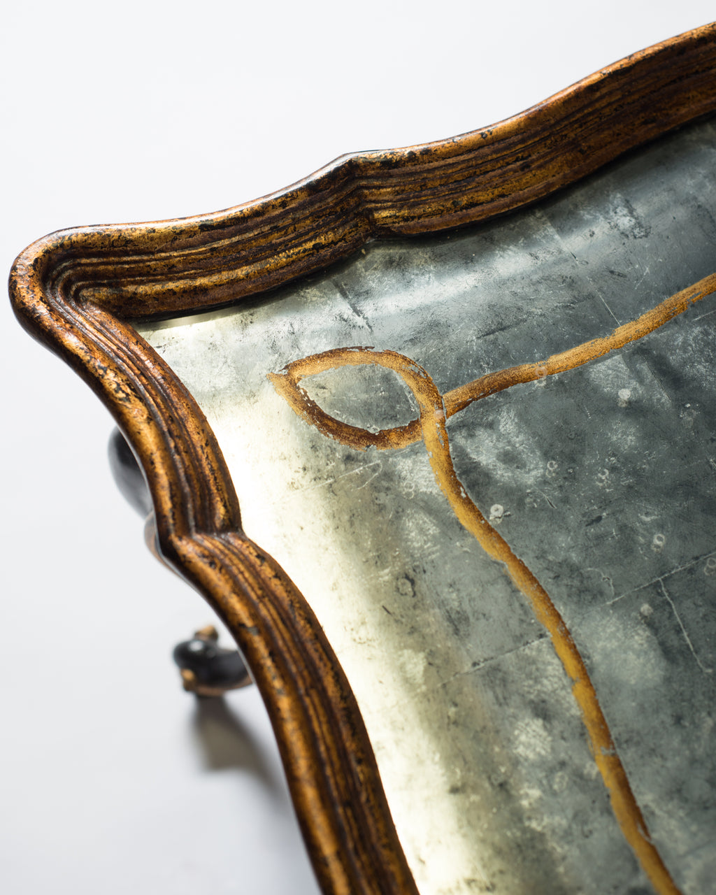 PAIR OF BLACK & GILDED COFFEE TABLES WITH EGLOMISE TOPS