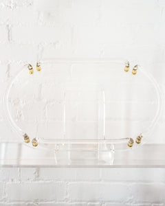 CONTEMPORARY ACRYLIC OVAL TRAY WITH BRASS DETAILS