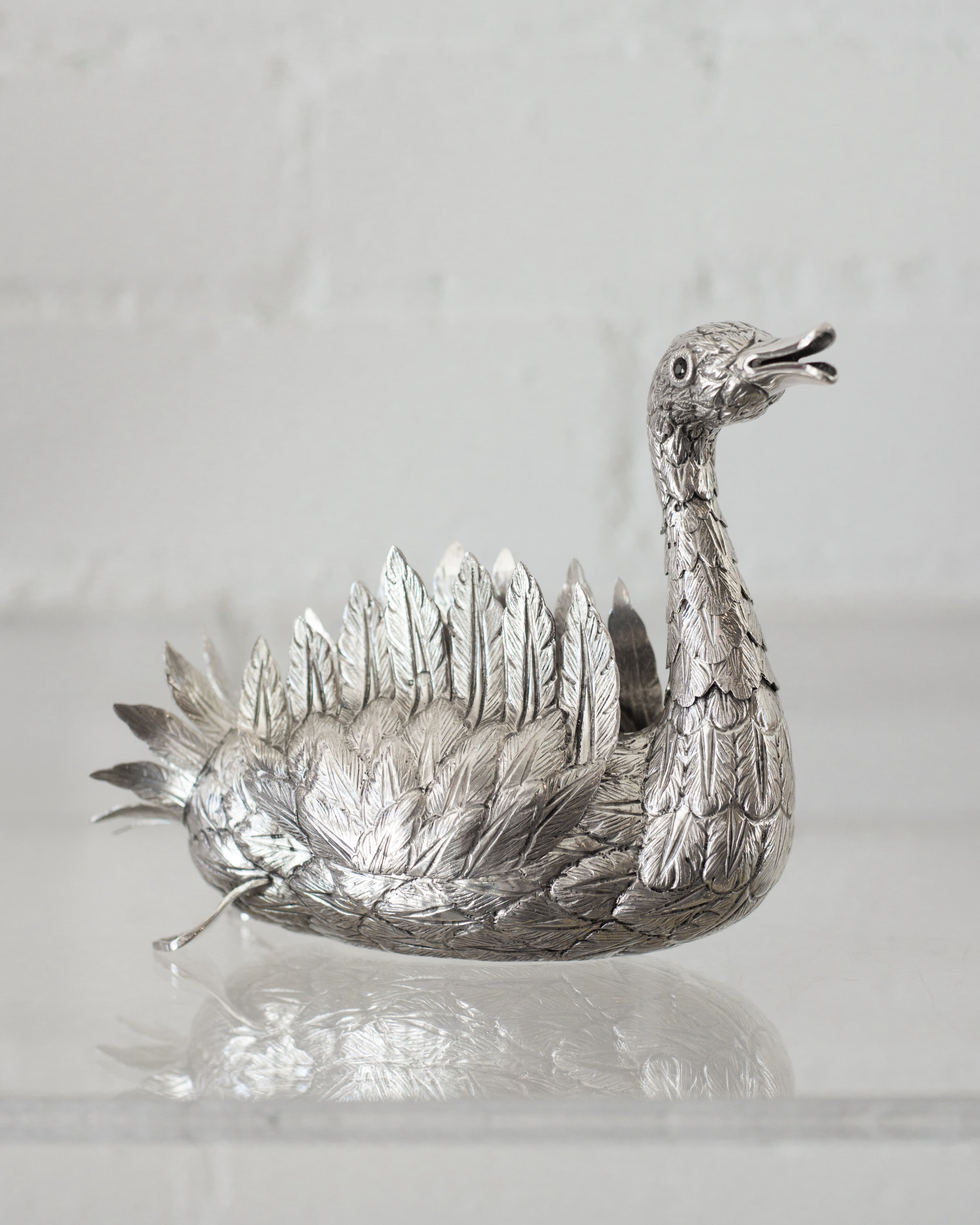 A CONTEMPORARY HAND CHASED 925 STERLING SILVER SWAN