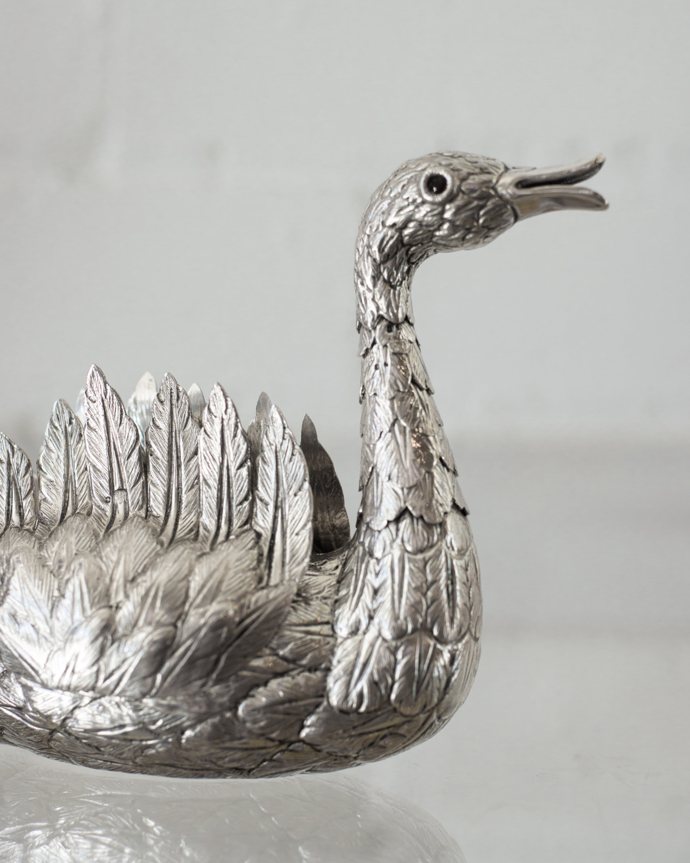 A CONTEMPORARY HAND CHASED 925 STERLING SILVER SWAN