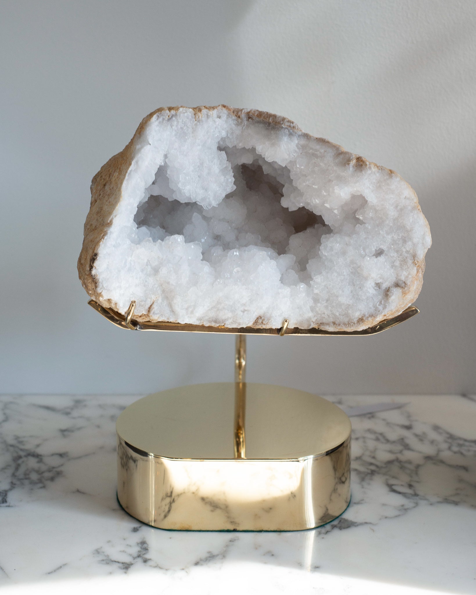 STUDIO MAISON NURITA WHITE QUARTZ GEODE ON A CUSTOM BRASS BASE