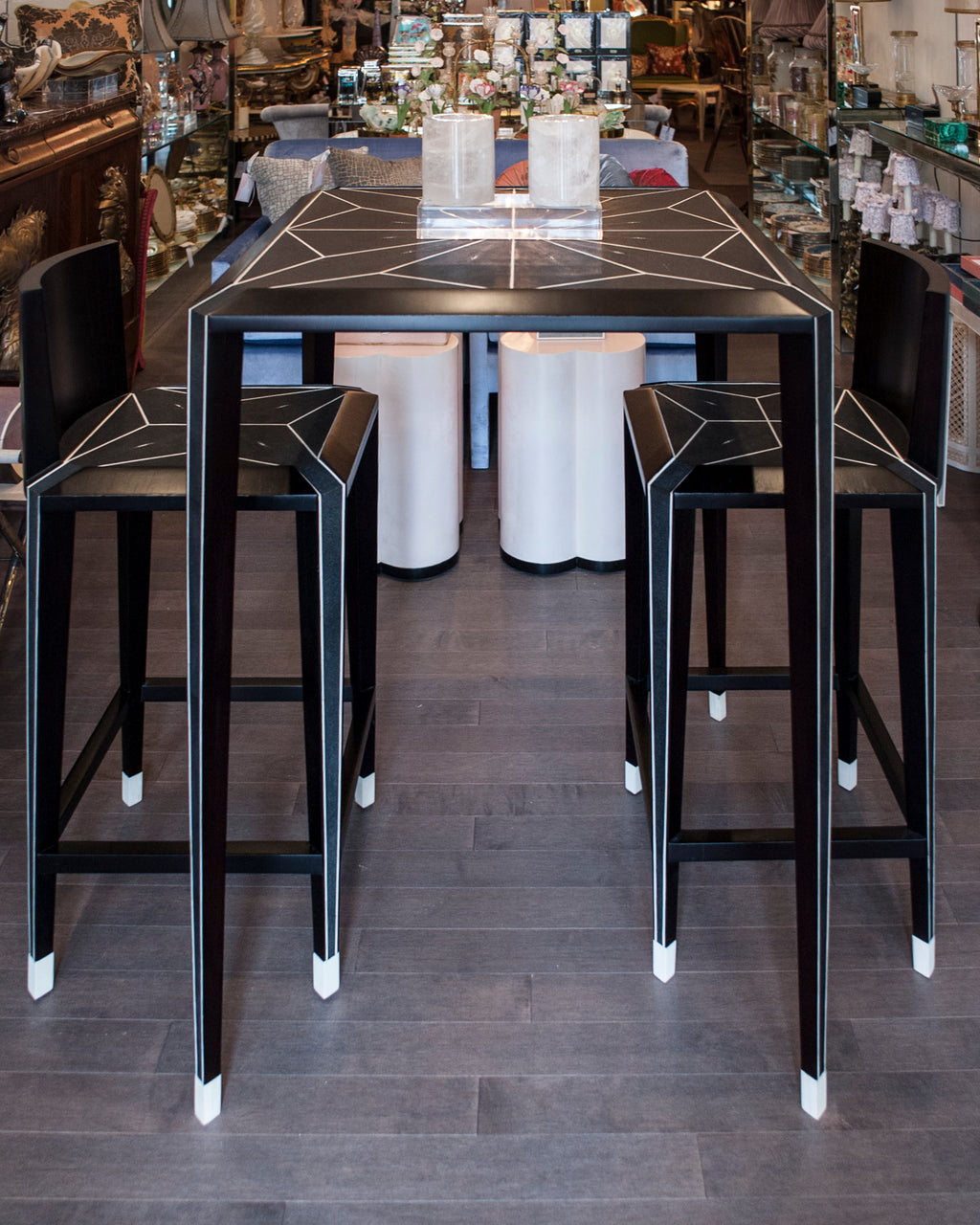 Enjoy sipping on your favourite cocktail while seated at this Shagreen bar table and chairs. It’s sleek modern lines exude sophistication while the bone details add refinement. Sold as a set.