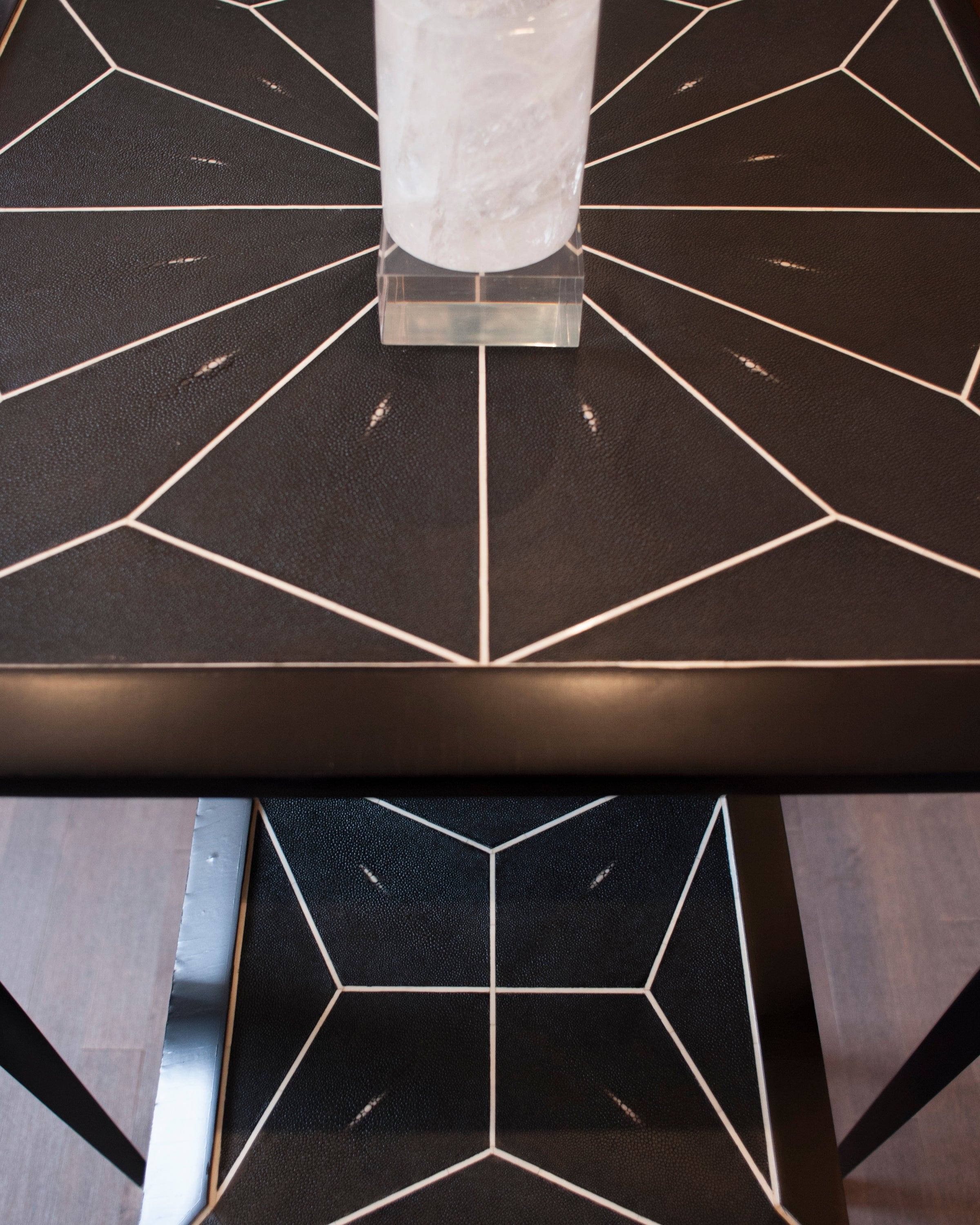 Enjoy sipping on your favourite cocktail while seated at this Shagreen bar table and chairs. It’s sleek modern lines exude sophistication while the bone details add refinement. Sold as a set.