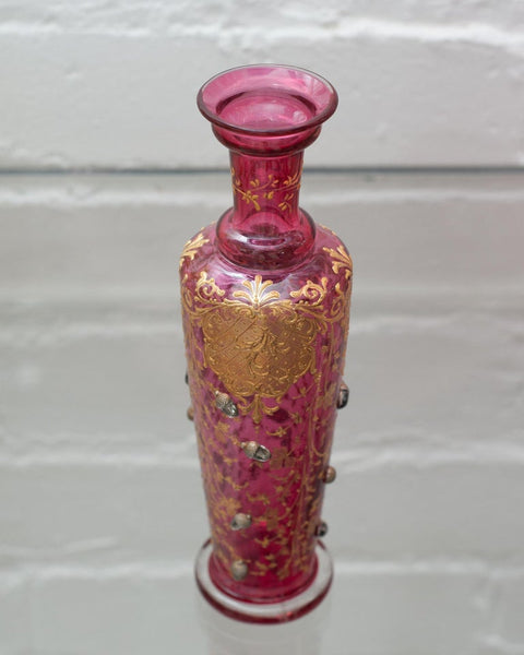 ANTIQUE MOSER CRANBERRY BUD VASE WITH GILDING AND ACORNS