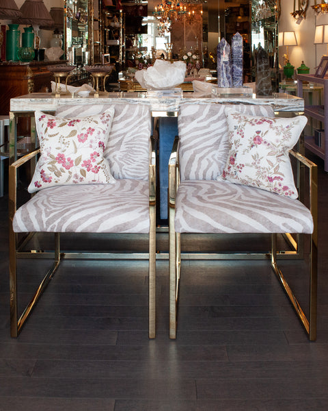 PAIR OF CONTEMPORARY POLISHED BRASS AND ZEBRA-PRINT UPHOLSTERED ARMCHAIRS