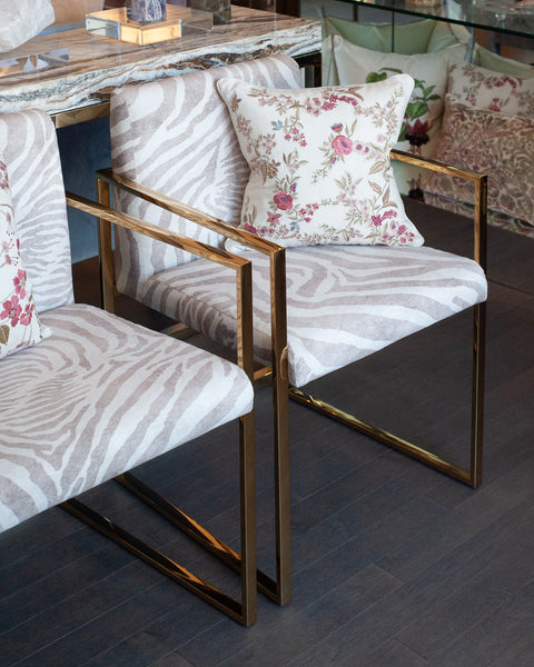 PAIR OF CONTEMPORARY POLISHED BRASS AND ZEBRA-PRINT UPHOLSTERED ARMCHAIRS