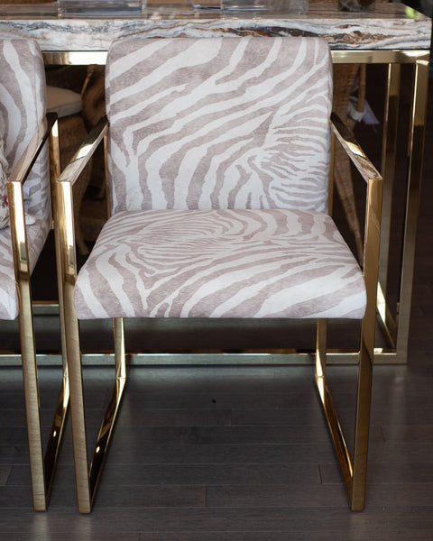 PAIR OF CONTEMPORARY POLISHED BRASS AND ZEBRA-PRINT UPHOLSTERED ARMCHAIRS