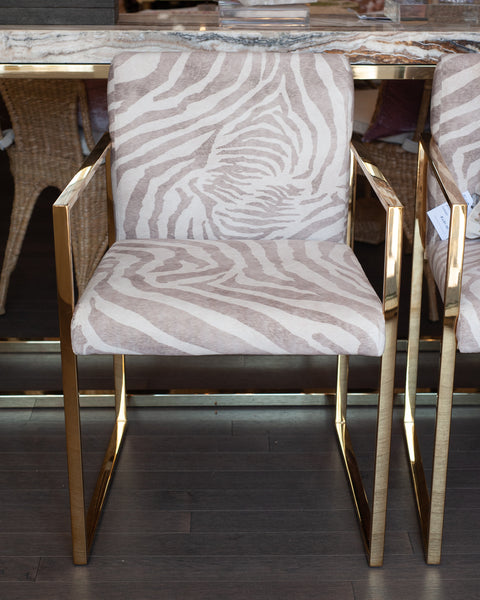 PAIR OF CONTEMPORARY POLISHED BRASS AND ZEBRA-PRINT UPHOLSTERED ARMCHAIRS