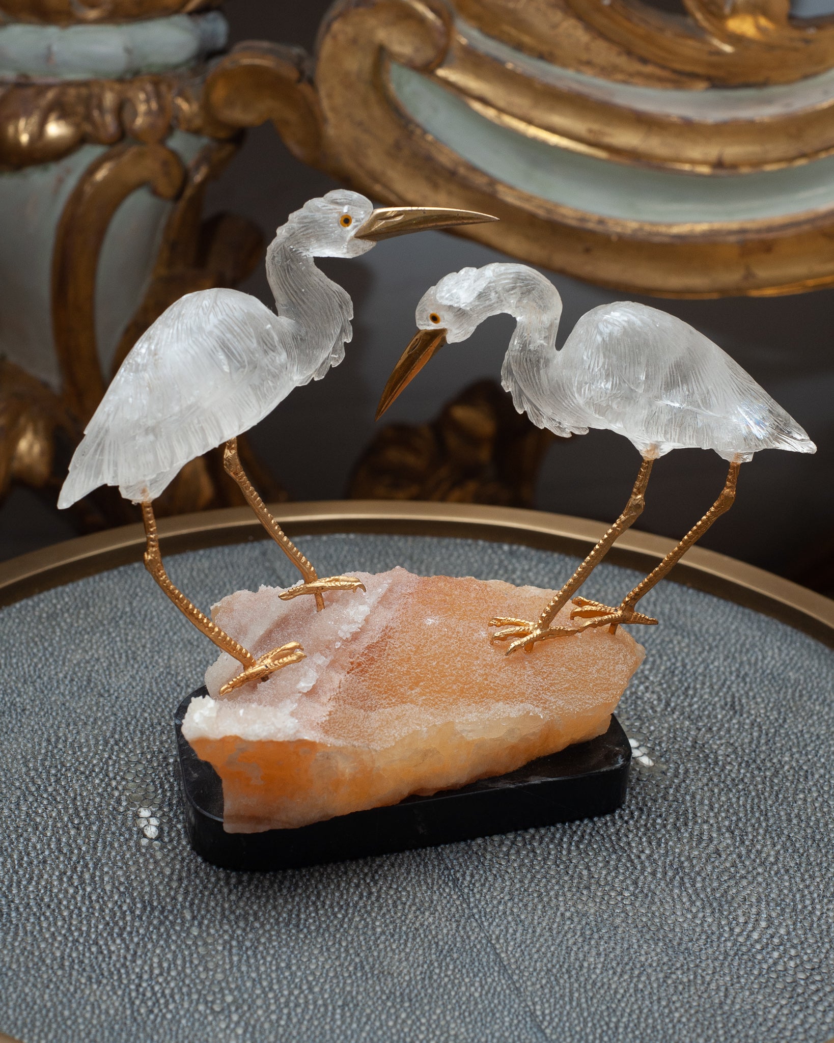 MID CENTURY PAIR OF ROCK CRYSTAL CRANES ON A ORANGE CALCITE AND BLACK MARBLE BASE