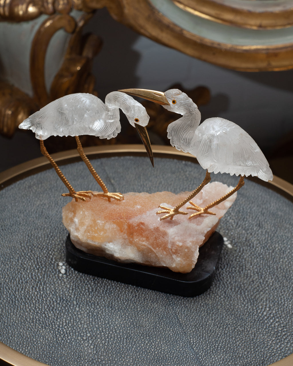 MID CENTURY PAIR OF ROCK CRYSTAL CRANES ON A ORANGE CALCITE AND BLACK MARBLE BASE