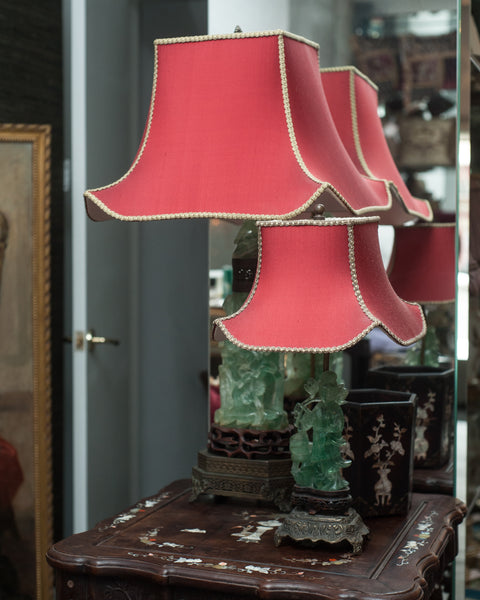 A beautiful large Antique Chinese carved fluorite lamp on a bronze base with a custom "Pagoda" shade in red silk and vintage metallic trim, re-wired with a silk cord. When switched on, the carved fluorite is illuminated from the inside.